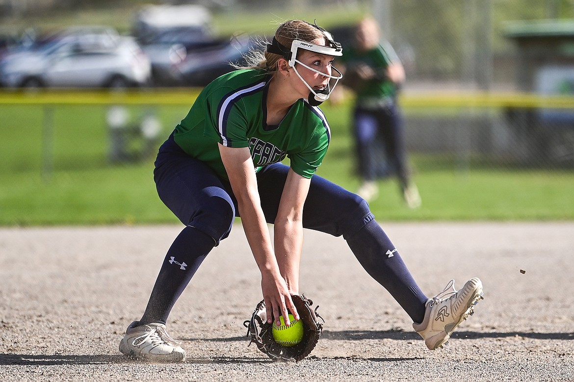 Glacier third baseman Olivia Warriner (10) charges and fields a bunt against Flathead at Kidsports Complex on Thursday, May 16. (Casey Kreider/Daily Inter Lake)