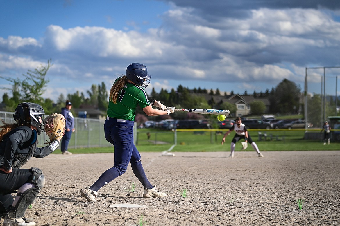 Glacier's Emma Cooke (11) connects on a single against Flathead at Kidsports Complex on Thursday, May 16. (Casey Kreider/Daily Inter Lake)