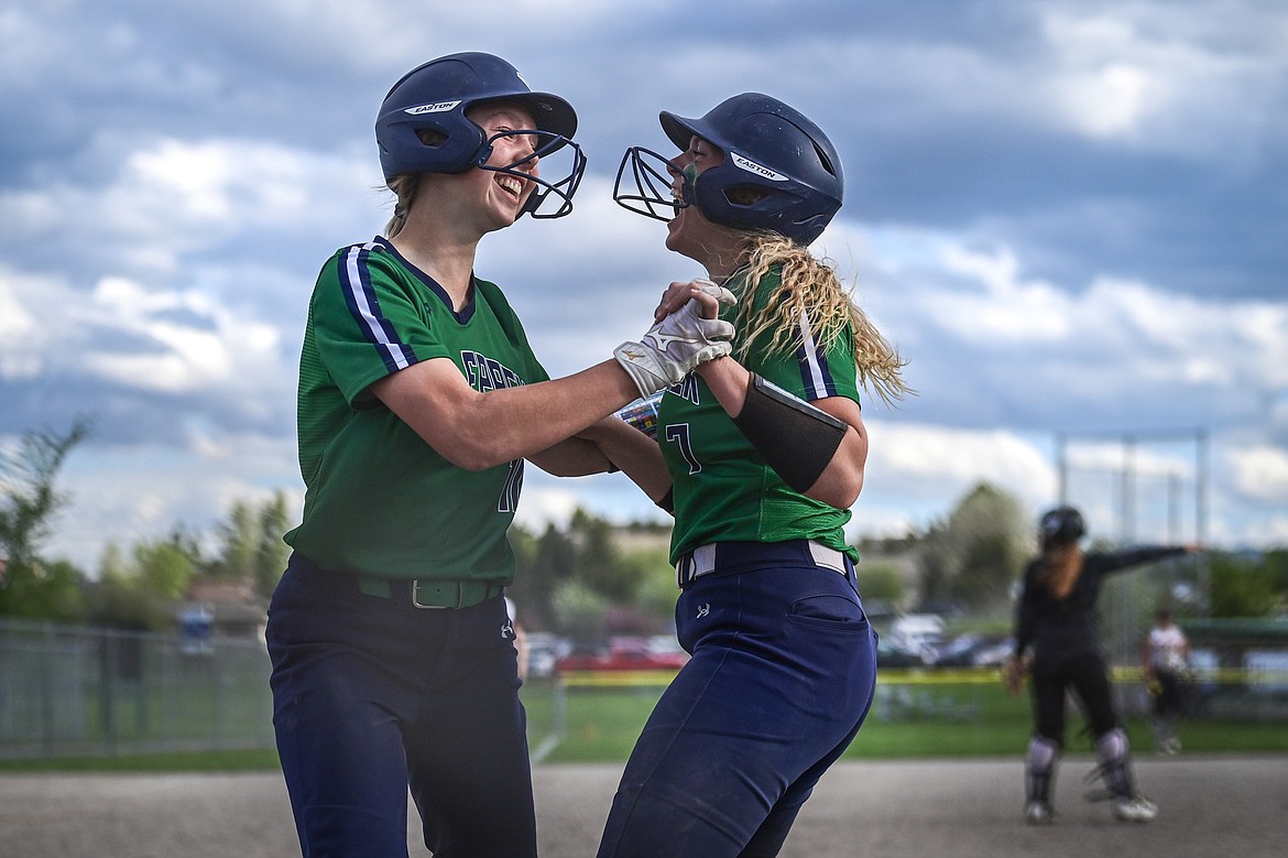 Glacier's Olivia Warriner (10) and Cazz Rankosky (7) celebrate after scoring on Warriner's two-run double after a pair of throwing errors in the seventh inning against Flathead at Kidsports Complex on Thursday, May 16. (Casey Kreider/Daily Inter Lake)