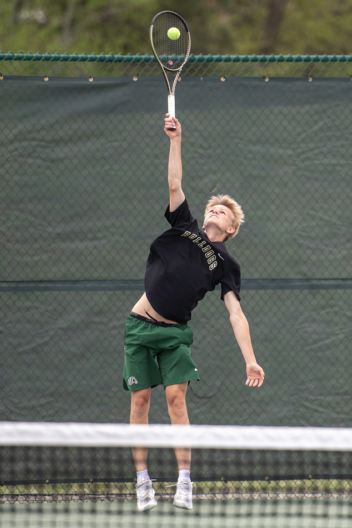 Bulldog Buren Brust serving at the Northwest A Divisional tennis tournament. (Avery Howe Photo)