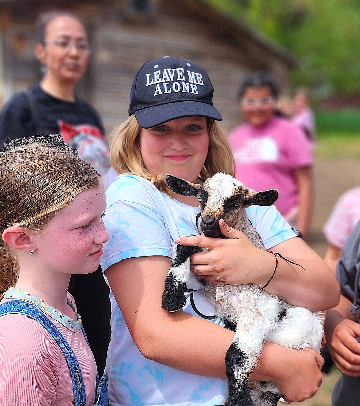 Student Annabelle Seibert holds a Nigerian Dwarf Fainting Goat kid. The baby goats were a big hit with the kids at 4th grade Ag Days. (Berl Tiskus/Leader)