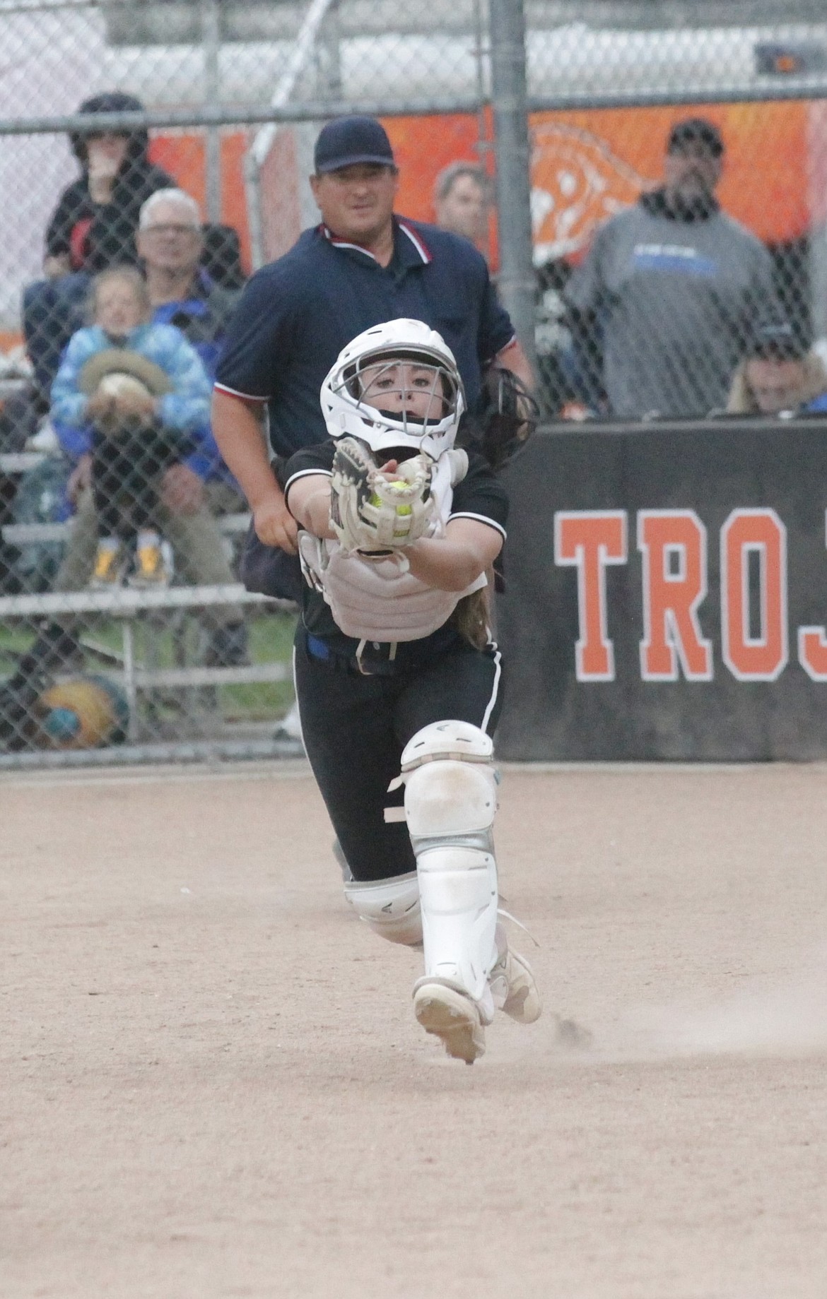 MARK NELKE/Press
Coeur d'Alene freshman catcher Kyndal Bridge catches a popup against Owyhee on Thursday in the first round of the state 5A softball tournament at Post Falls High.