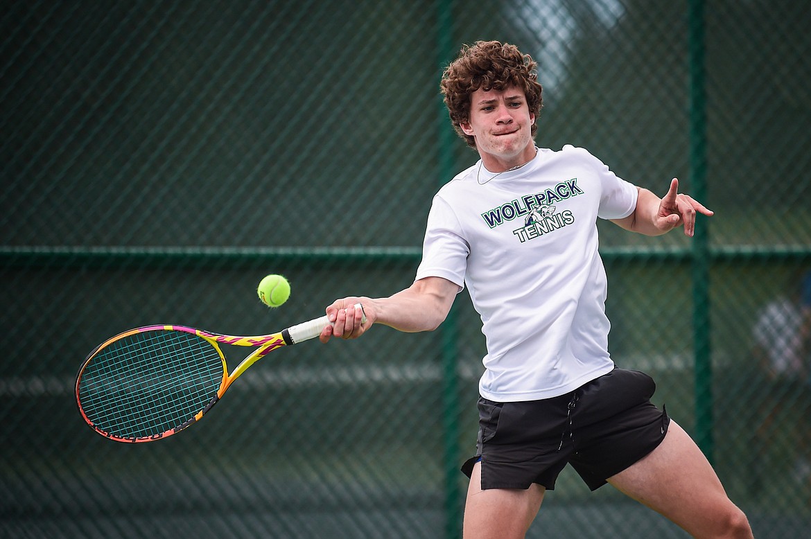 Glacier's Will Rudbach hits a return in the boys doubles final with teammate Sam Engellant against Great Falls CMR's Eli Crist and Josh Stimac at the AA Northern Divisional Tennis Tournament at Flathead Valley Community College on Friday, May 17. (Casey Kreider/Daily Inter Lake)