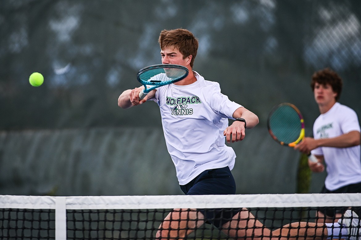 Glacier's Sam Engellant hits a return at the net in the boys doubles final with teammate Will Rudbach against Great Falls CMR's Eli Crist and Josh Stimac at the AA Northern Divisional Tennis Tournament at Flathead Valley Community College on Friday, May 17. (Casey Kreider/Daily Inter Lake)