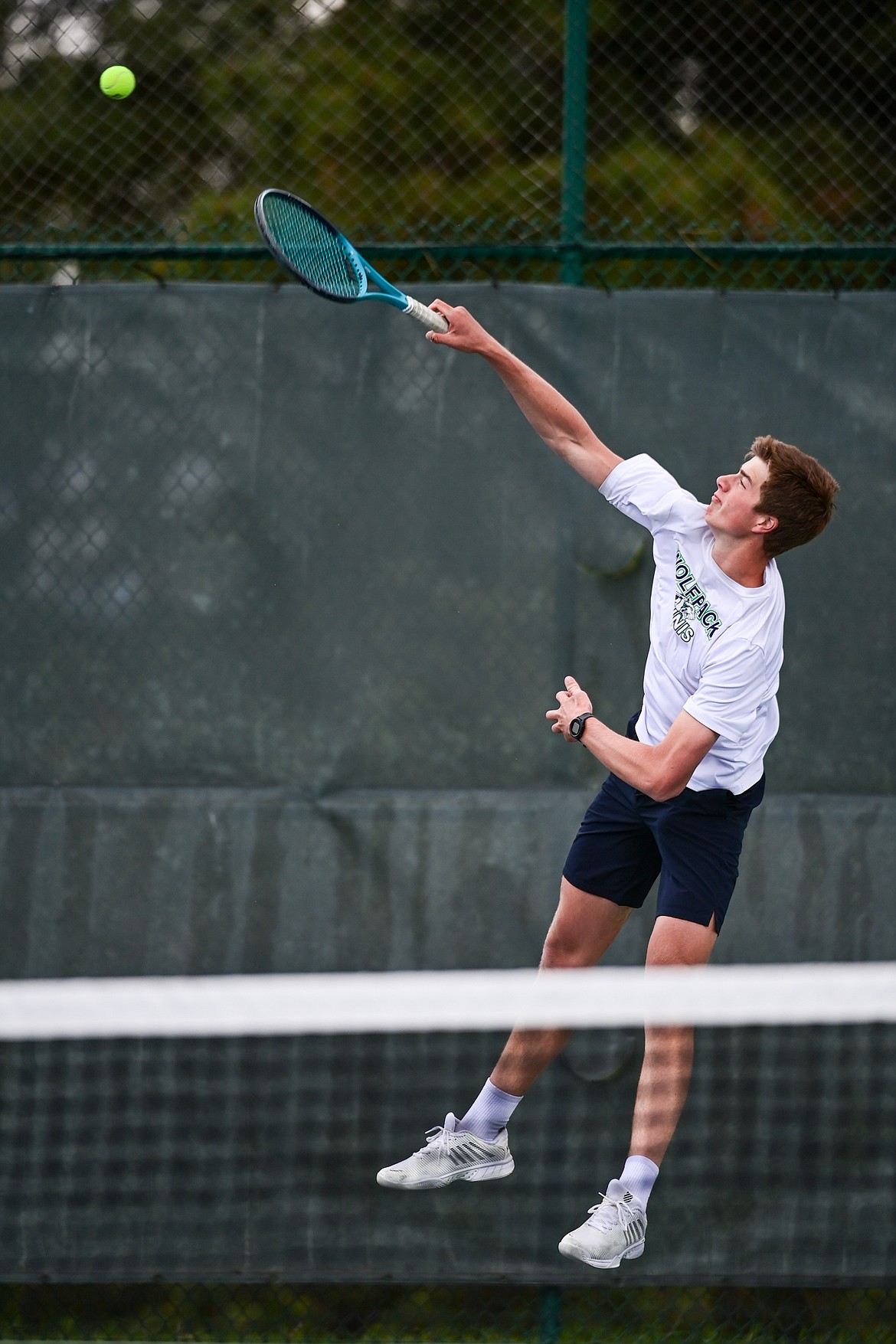 Glacier's Sam Engellant serves in the boys doubles final with teammate Will Rudbach against Great Falls CMR's Eli Crist and Josh Stimac at the AA Northern Divisional Tennis Tournament at Flathead Valley Community College on Friday, May 17. (Casey Kreider/Daily Inter Lake)