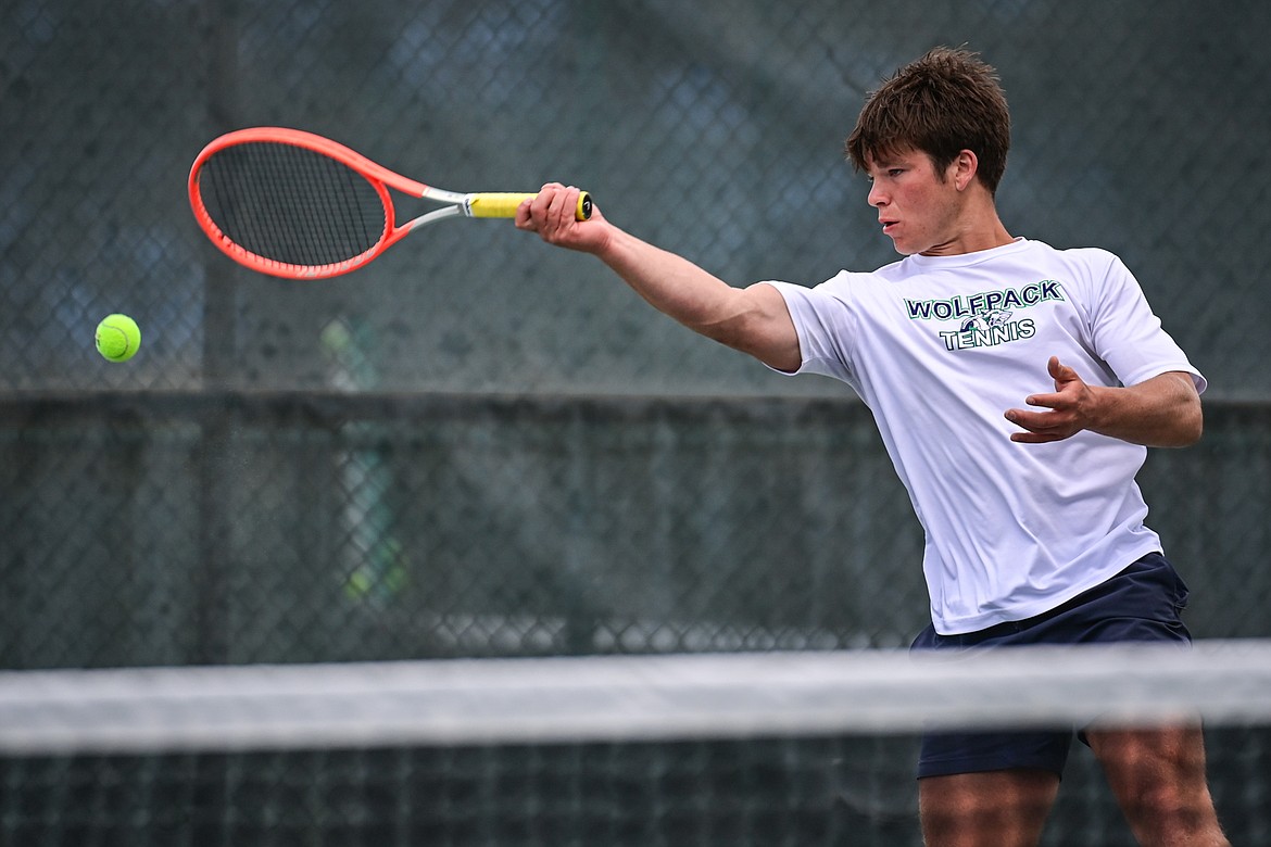 Glacier's Kutuk White hits a return in a boys singles match against Great Falls' Chad Wyman in the AA Northern Divisional Tennis Tournament at Flathead Valley Community College on Friday, May 17. (Casey Kreider/Daily Inter Lake)