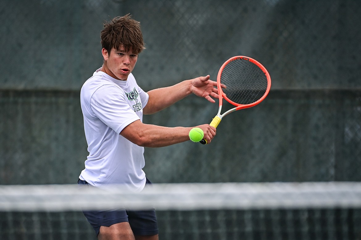 Glacier's Kutuk White hits a return in a boys singles match against Great Falls' Chad Wyman in the AA Northern Divisional Tennis Tournament at Flathead Valley Community College on Friday, May 17. (Casey Kreider/Daily Inter Lake)