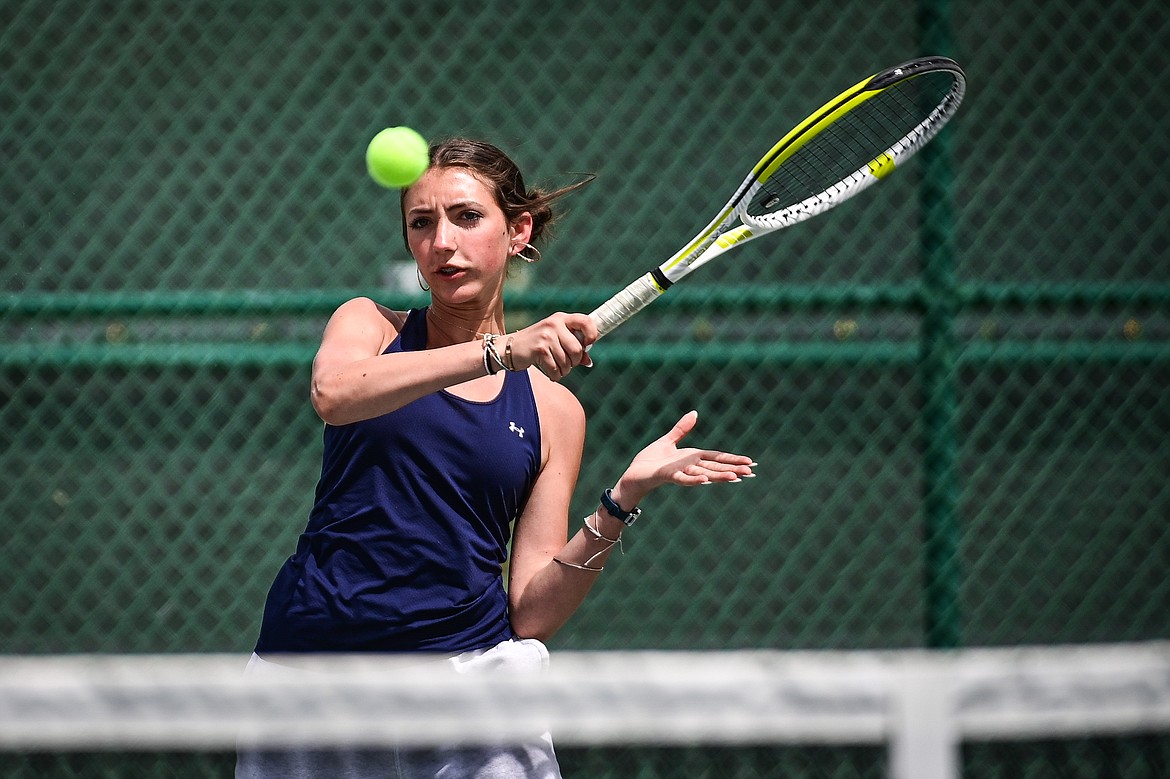 Glacier's Leilani Lennarz hits a return in a girls singles match against Great Falls CMR's Coco Brown in the AA Northern Divisional Tennis Tournament at Flathead Valley Community College on Friday, May 17. (Casey Kreider/Daily Inter Lake)