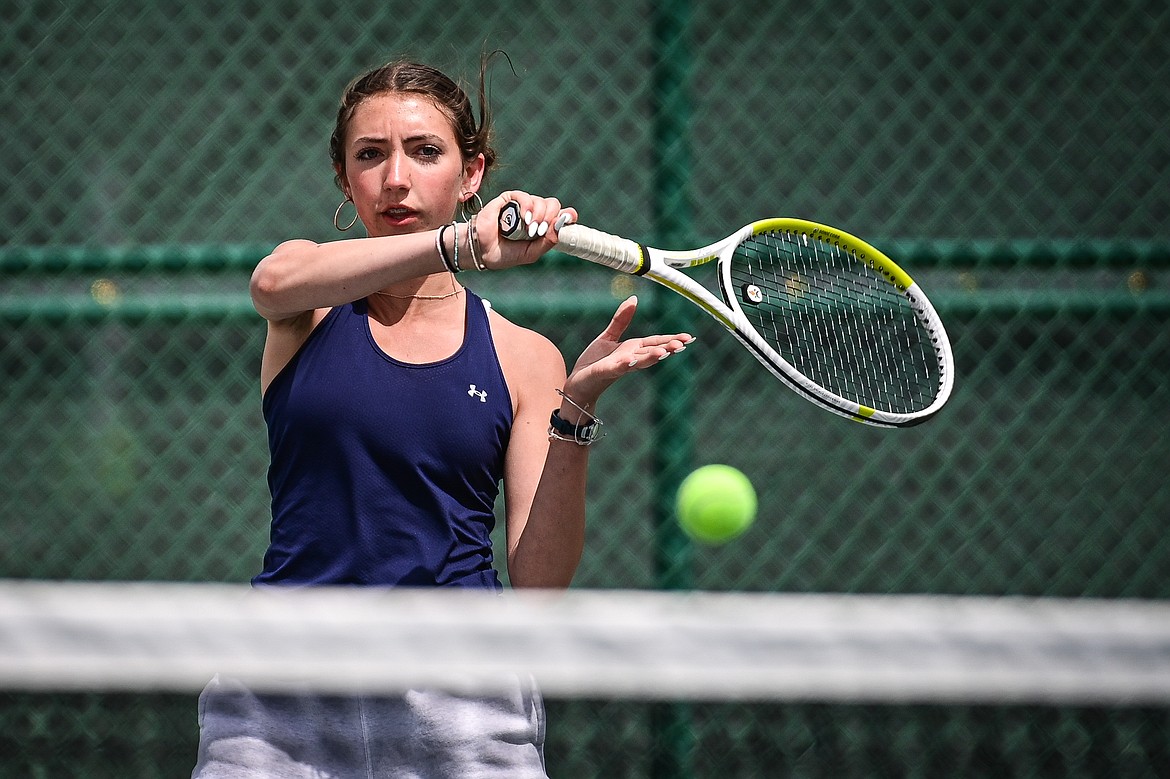 Glacier's Leilani Lennarz hits a return in a girls singles match against Great Falls CMR's Coco Brown in the AA Northern Divisional Tennis Tournament at Flathead Valley Community College on Friday, May 17. (Casey Kreider/Daily Inter Lake)