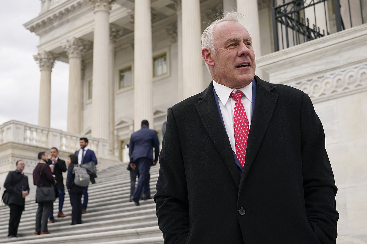 Rep. Ryan Zinke, R-Mont., stands on the East Front of the Capitol after participating in a class photo of newly-elected members of Congress, Tuesday, Nov. 15, 2022, in Washington. (AP Photo/Patrick Semansky FILE)