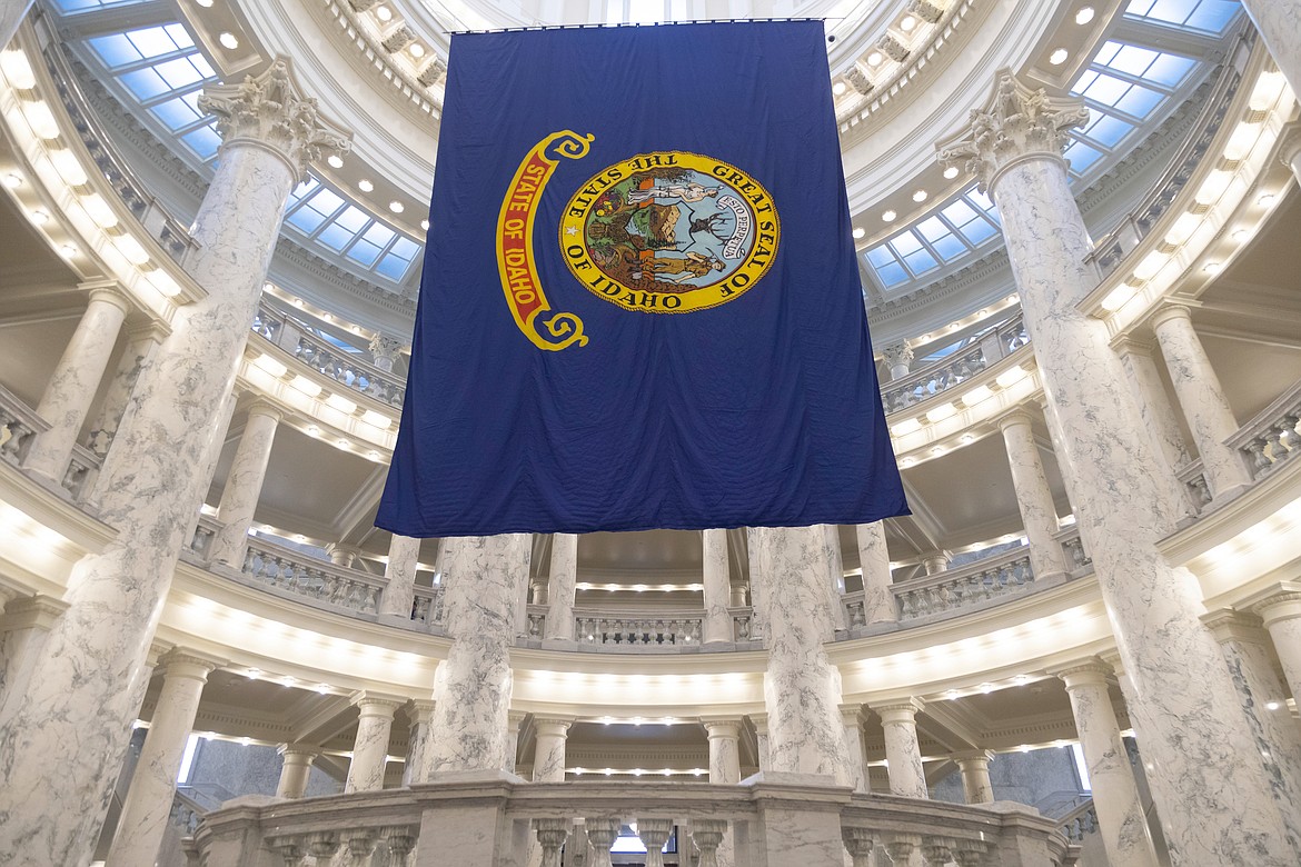 The Idaho state flag hangs in the State Capitol in Boise, Idaho, Jan. 9, 2023. Idaho voters are heading to the polls to decide primaries for the U.S. House and state legislature. (AP Photo/Kyle Green, File)