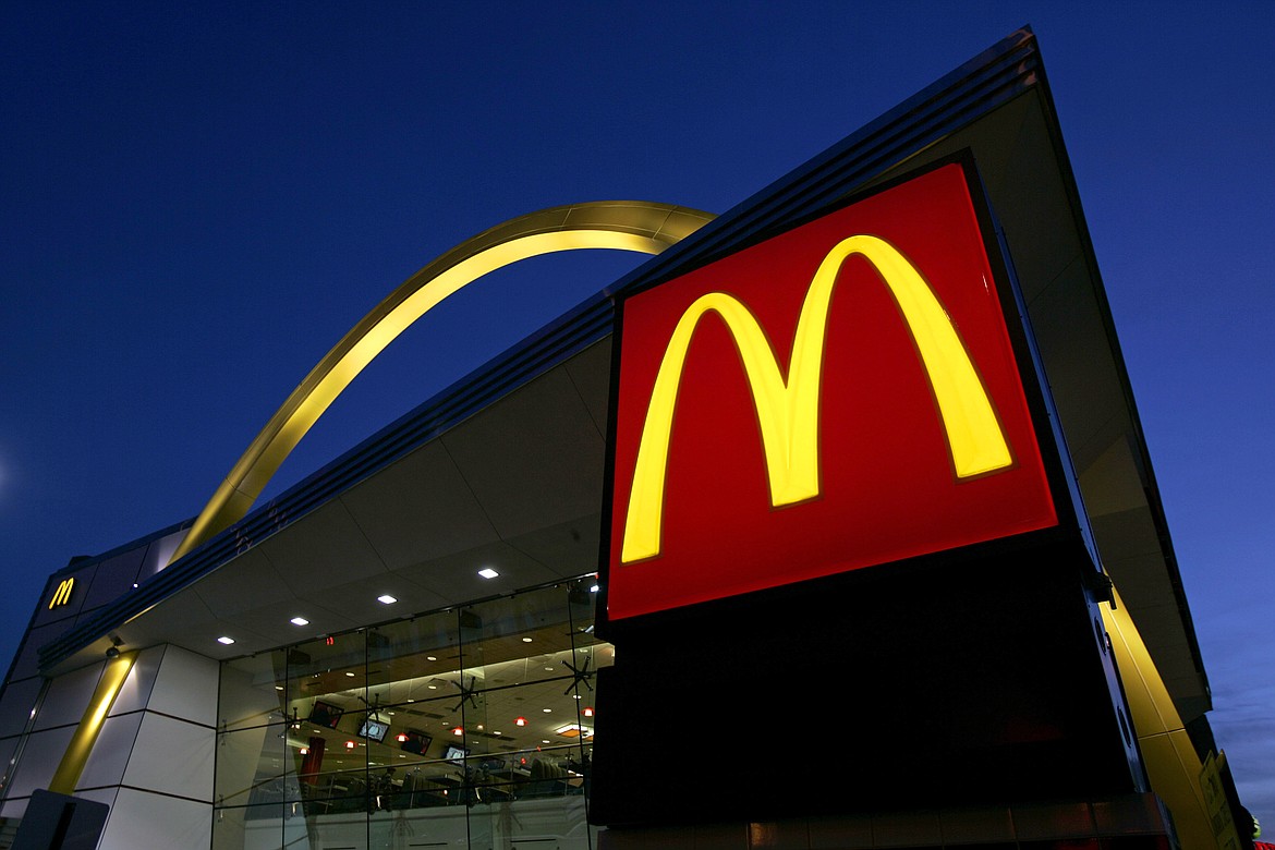 FILE - The McDonald's restaurant logo and golden arch is lit up, April 20, 2006, in Chicago. McDonald’s plans to introduce a $5 meal deal in the U.S. in June 2024 to counter slowing sales and customers’ frustration with high prices. (AP Photo/Jeff Roberson, File)