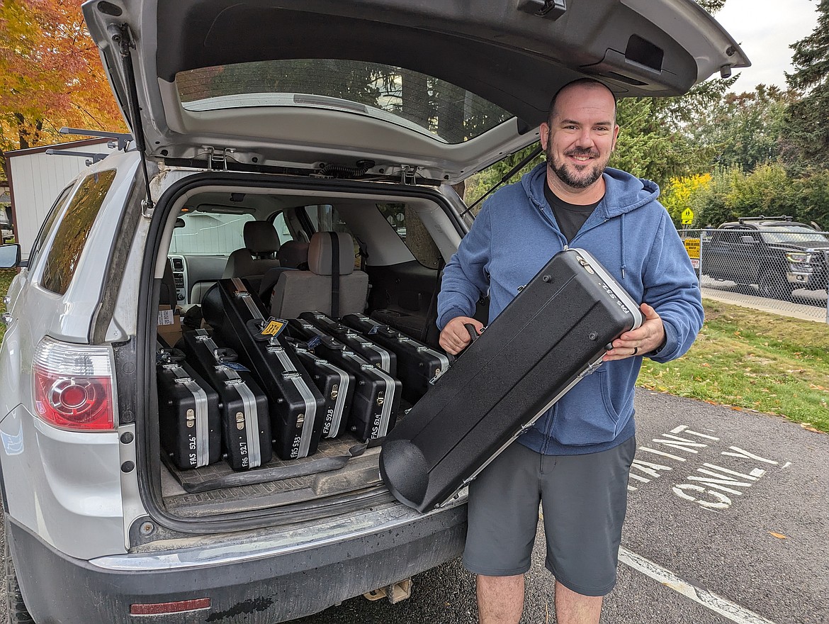 Festival at Sandpoint production and education manager Paul Gunter delivers 14 new Eastman trombones to Lake Pend Oreille School District band programs.