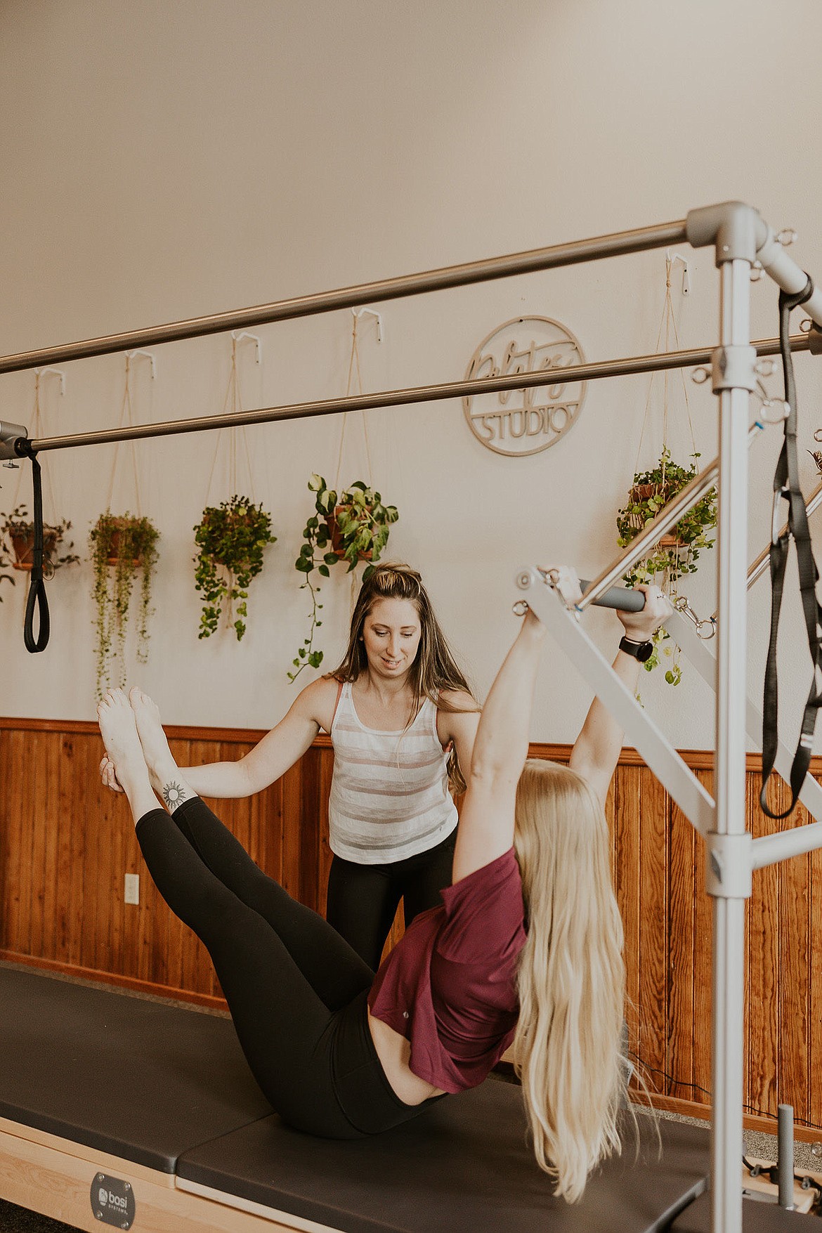 Jennie Johnson, owner of The Pilates Scene, works with a client. (Photo courtesy of Haley Jessat of Haley J Photo)