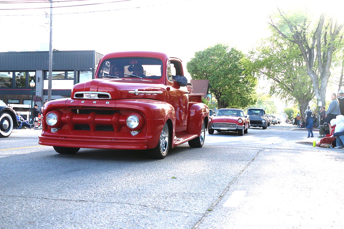 Classic cars make their way down Church Street during the annual Lost in the '50s car parade on Friday.