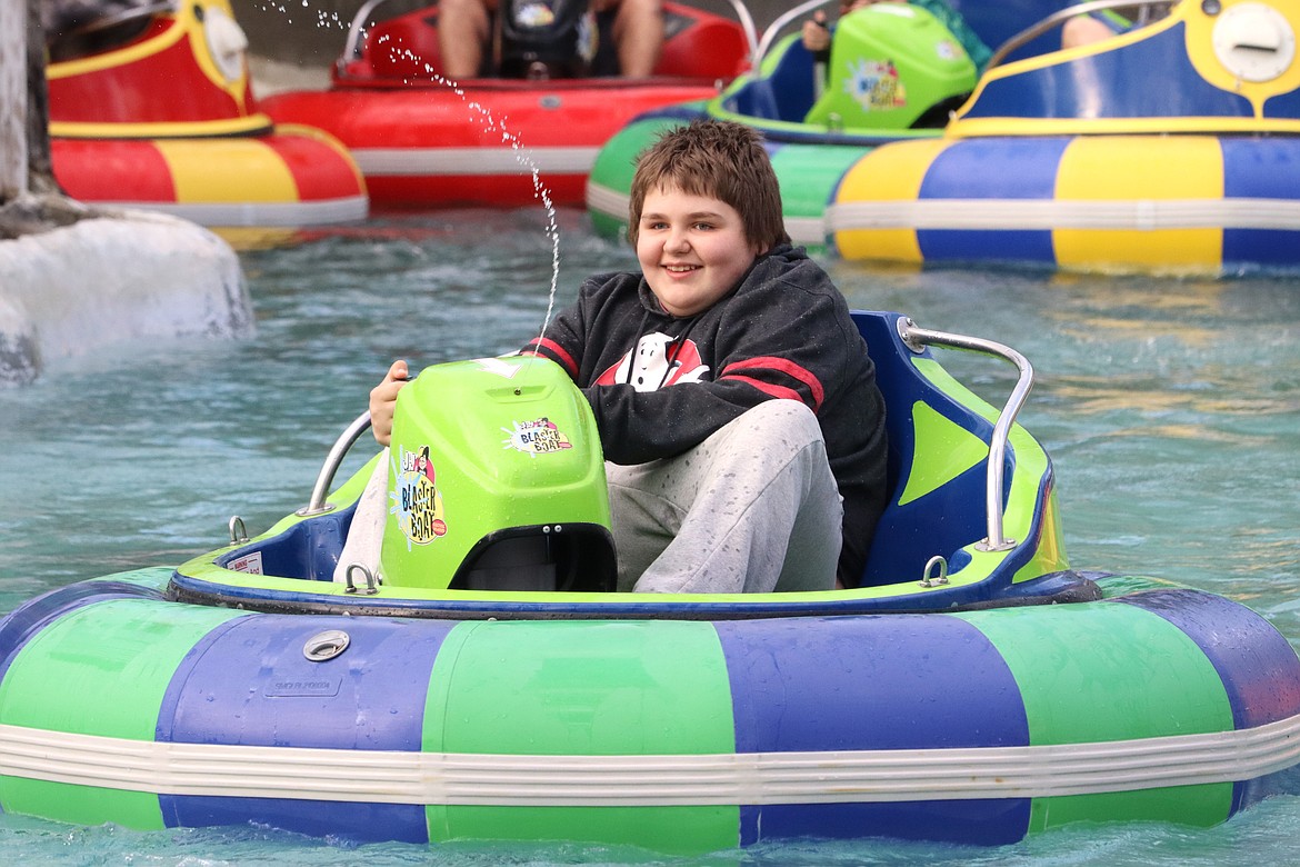 Jonathan Lunsford enjoys the bumper boat ride during Night of the Stars at Silverwood Theme Park on Friday. About 6,000 people attended the annual event 
when Silverwood invites anyone who is terminally ill or faces physical or mental challenges to come to the park for free. This special evening has been designed to be sensitive to the various needs of all “Stars."