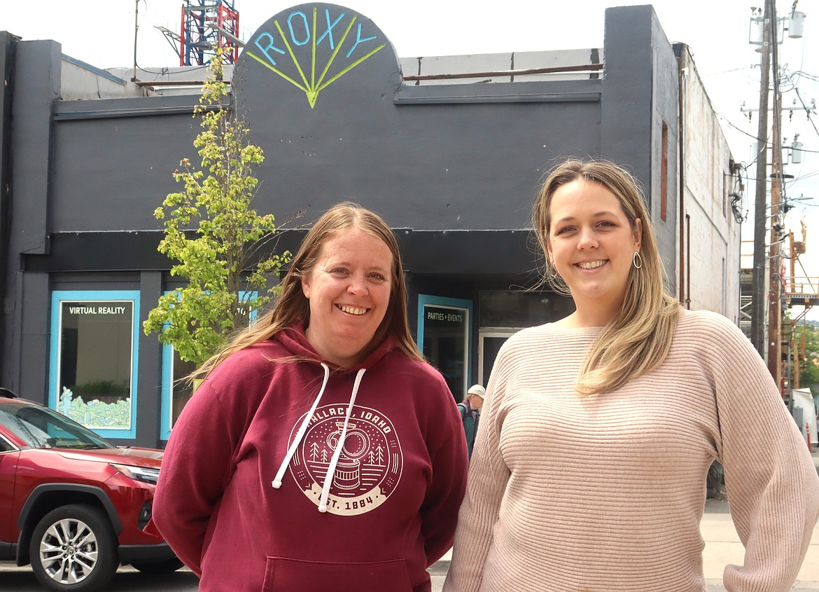 Britt Thurman, right, executive director of The Museum of North Idaho, and volunteer coordinator Jordan Thomas stand in front of the old Roxy Theater on Fourth Street in downtown Coeur d'Alene on Friday. After it's cleaned up inside, the building owned by John Montandon will be the museum's temporary home for the next few months.