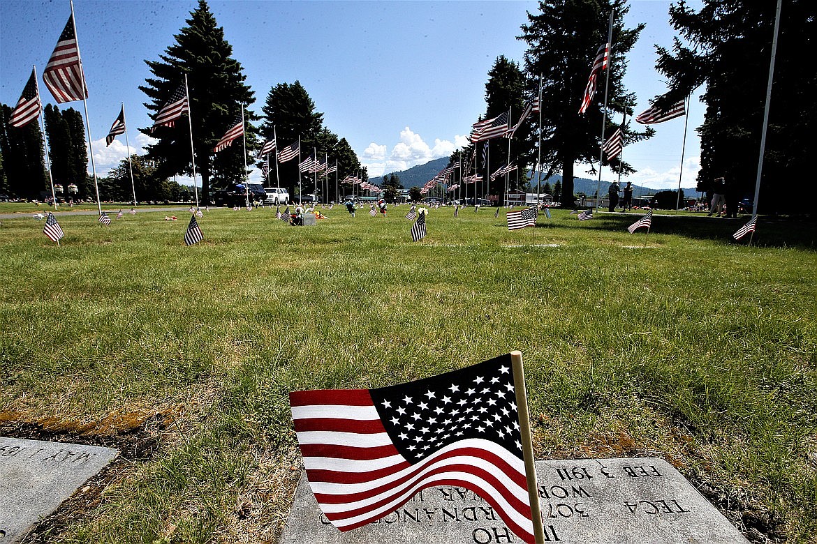 A flag flutters in the wind at Coeur d'Alene Memorial Gardens on Monday.