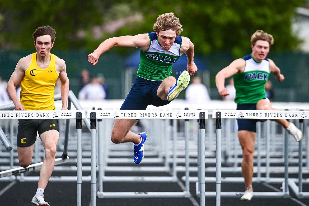 Glacier's Ethan Anderson clears a hurdle en route to a first place finish in the boys 100 meter hurdles at the Western AA Divisionals at Legends Stadium on Saturday, May 18. (Casey Kreider/Daily Inter Lake)