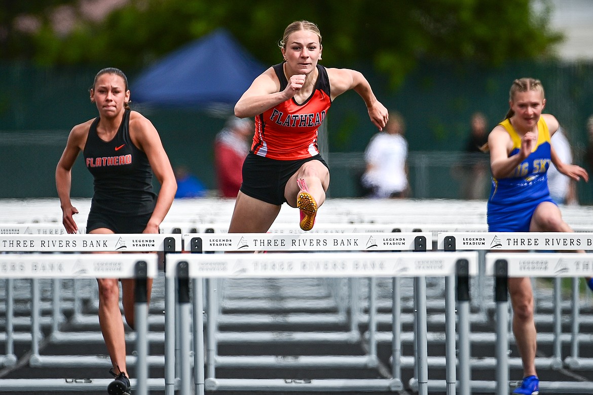 Flathead's Alivia Rinehart clears a hurdle en route to a third place finish in the girls 100 meter hurdles at the Western AA Divisionals at Legends Stadium on Saturday, May 18. (Casey Kreider/Daily Inter Lake)