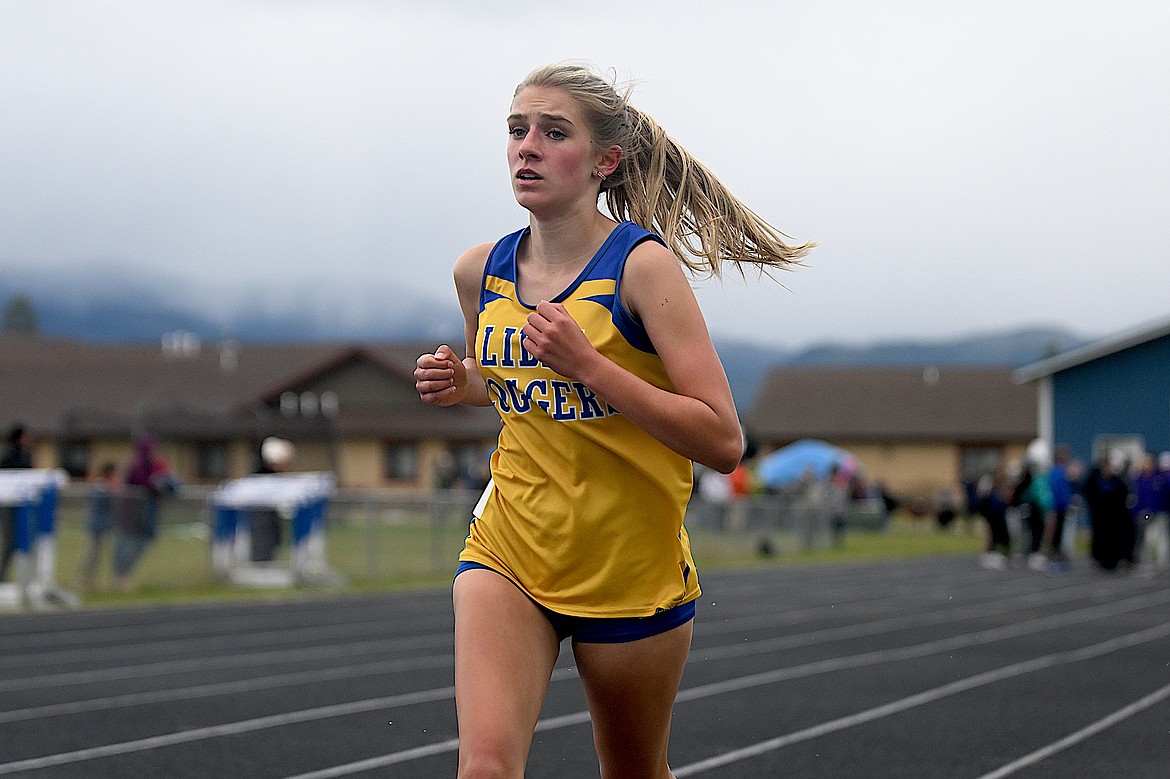 Libby eighth-grader student Capril Farmer runs in the 1,600-meter run in the Western A divisional meet Friday, April 17, 2024, in Columbia Falls. (Chris Peterson/Hungry Horse News)