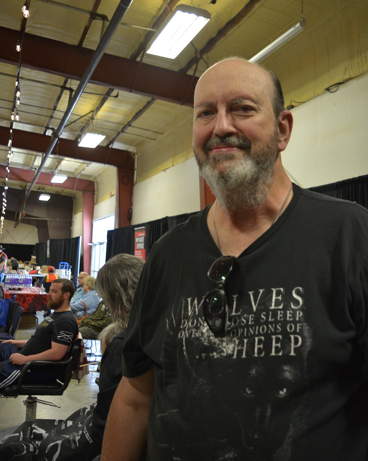 Greg Lindberg shows off his new haircut during the Veterans Stand Down event Saturday.