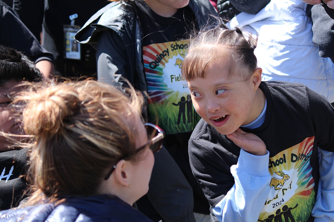 A participant at the face painting booth checks out the result.