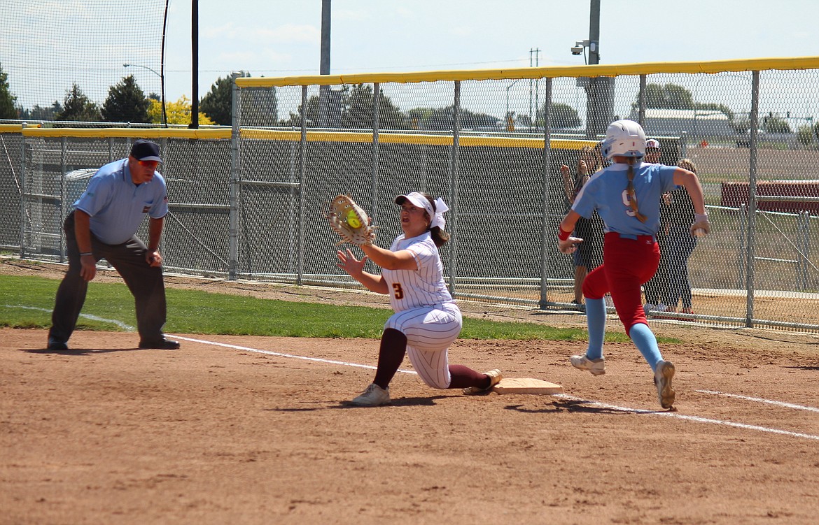 Jenika Balderas (3) stretches for the out at first in Moses Lake’s softball win Saturday.