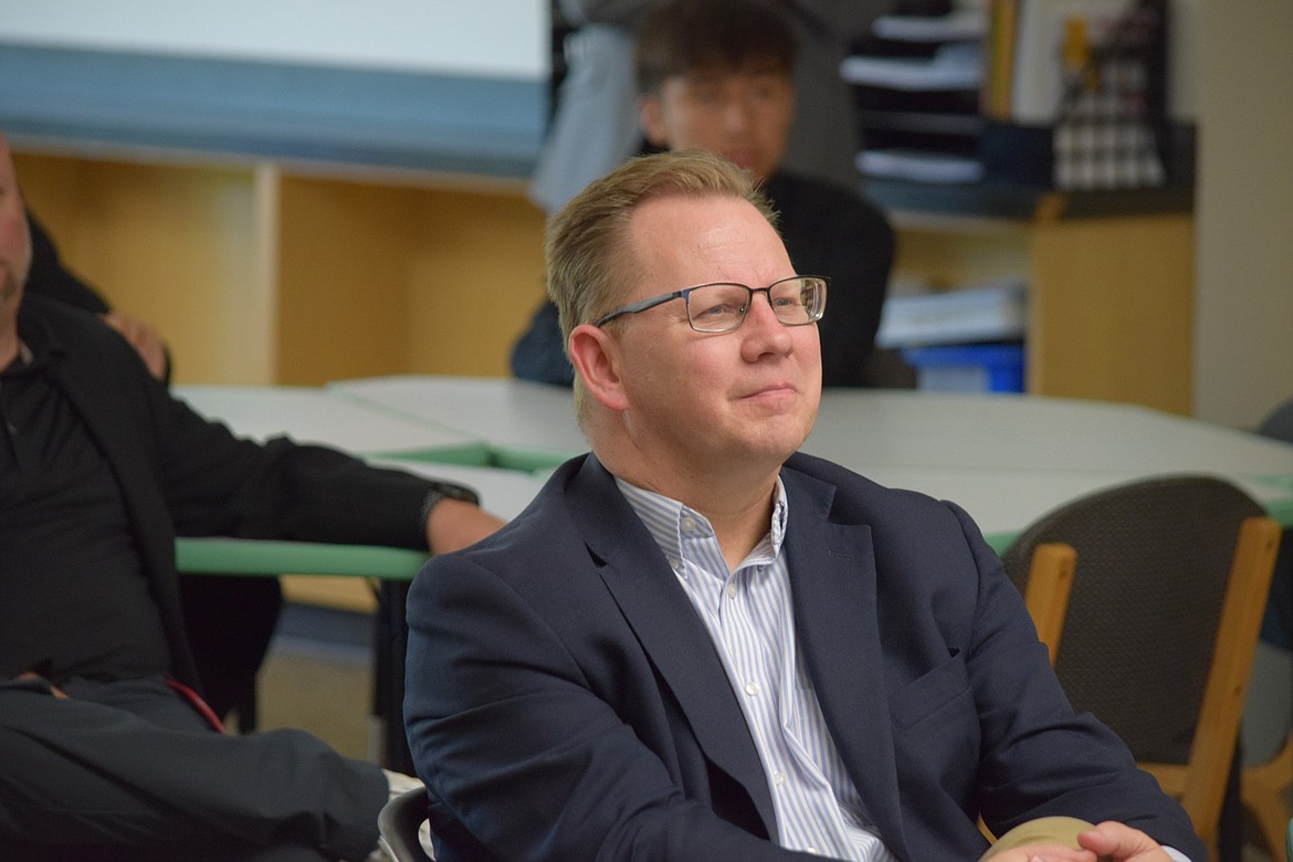 Superintendent of Public Instruction Chris Reykdal listens to an introductory presentation on the Wahluke School District in the Wahluke High School Library during his visit Thursday.