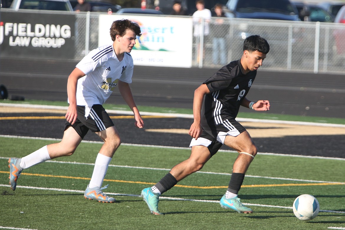 Royal junior Alexis Gonzalez (19) brings the ball upfield in the second half against Meridian on Friday evening.