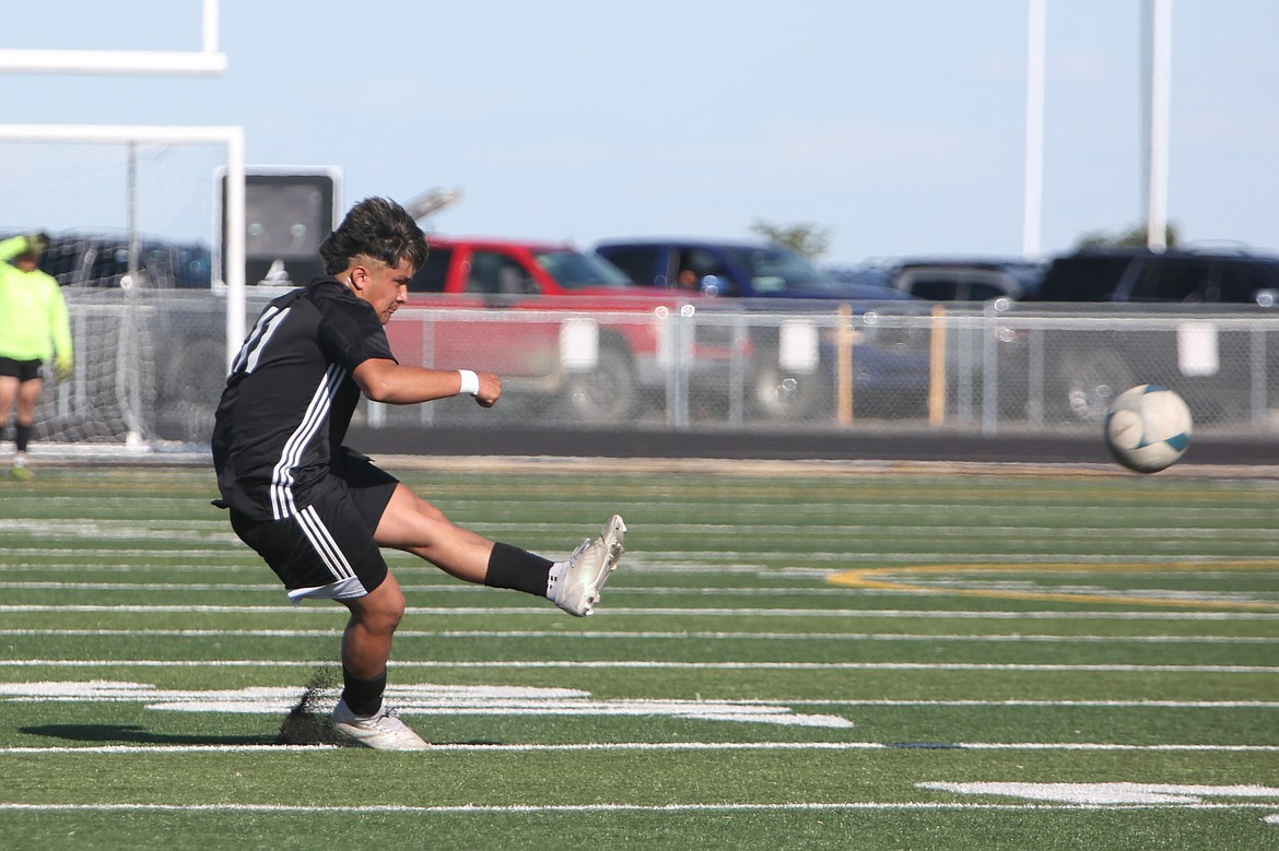 Royal senior Miguel Soriano sends the ball upfield on a free kick in the first half against Meridian on Friday.