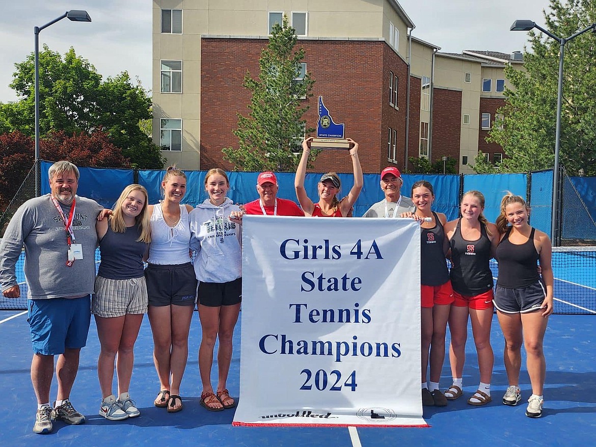 Courtesy photo
The 2024 Sandpoint girls tennis team shows off the state 4A tennis championship trophy. From left, coach Roger Alexander, Berkeley Cox, Elly Tutin, Neva Reseska, coach Kent Stadum, Pepper Rickert, coach Kent Anderson, Sydney Webb, Aubrey Knowles, and Lily Evans.