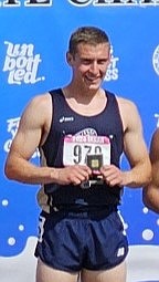 Courtesy photo
Timberlake High senior Caius Tebbe with his medal after winning the state 3A boys title in the 300-meter hurdles on Saturday at Middleton High.