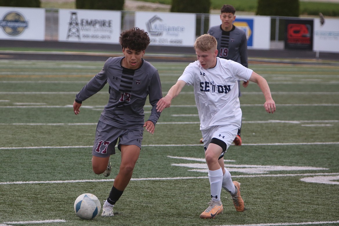 Wahluke freshman Icker Lopez (17) looks to get past a Seton Catholic defender during the first half of Friday’s match.