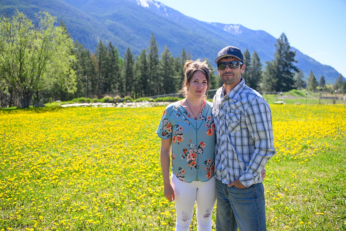 Luke and Leslie Sterling in the backyard of their Columbia Heights home in May 2024. (Chris Peterson photo)