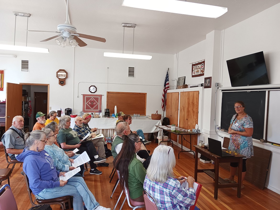 Heather Ewert teaches teaches a foraging class in the Old DeBorgia School. (Monte Turner/Mineral Independent)