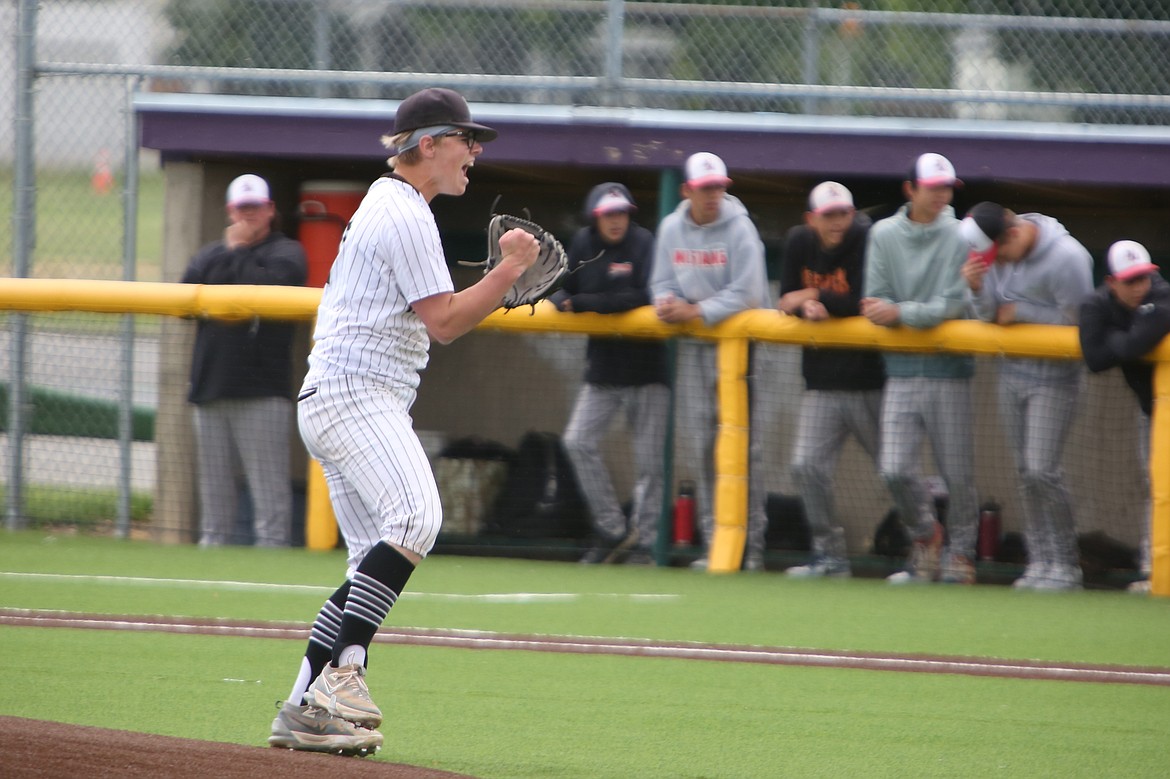 Almira/Coulee-Hartline sophomore Caden Correia, in white, yells out in celebration after striking out the final batter of Saturday’s 1B State Baseball Tournament quarterfinal game against Northport. Correia had 10 strikeouts and one hit surrendered in the win.