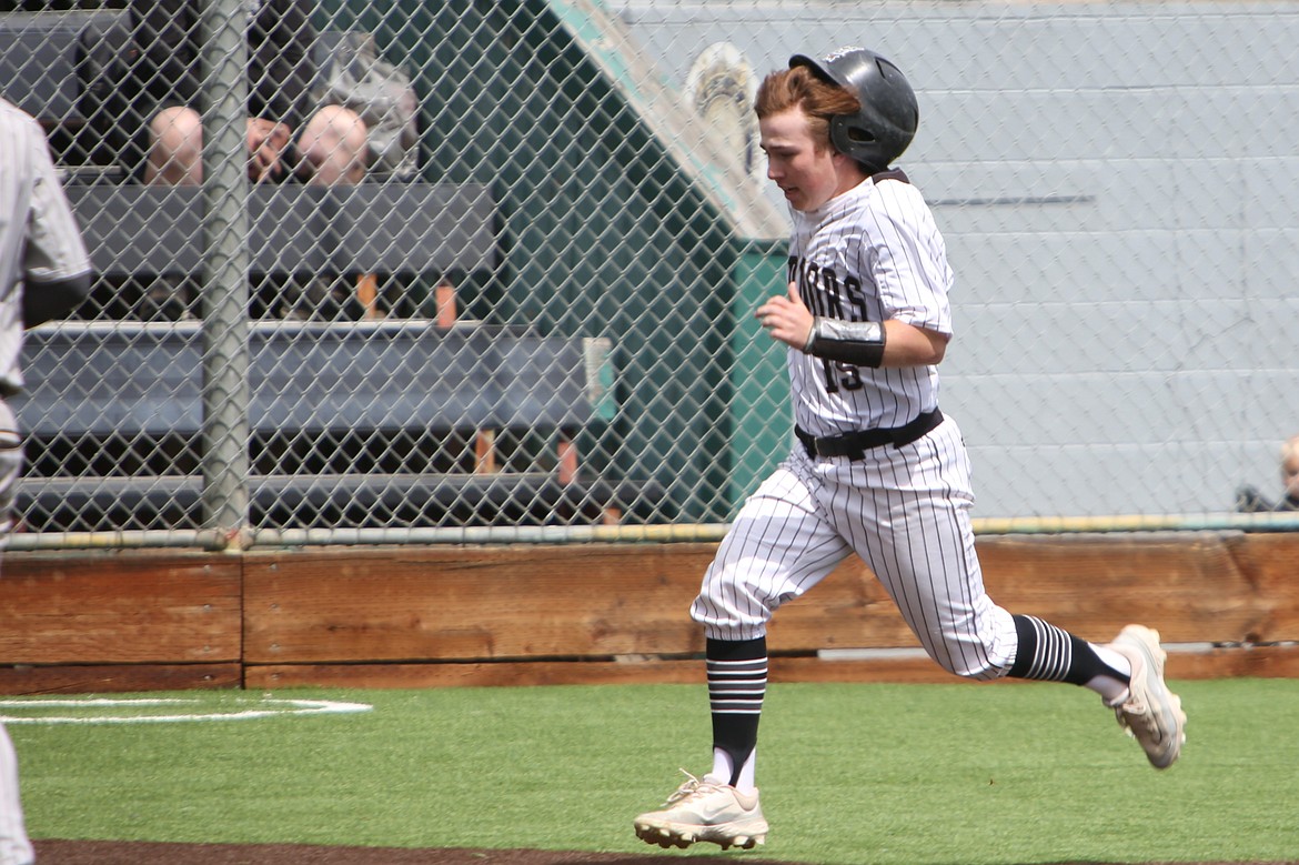 Almira/Coulee-Hartline freshman Brody Pitts dashes to home plate to score a run in the bottom of the fourth inning against Northport on Saturday.