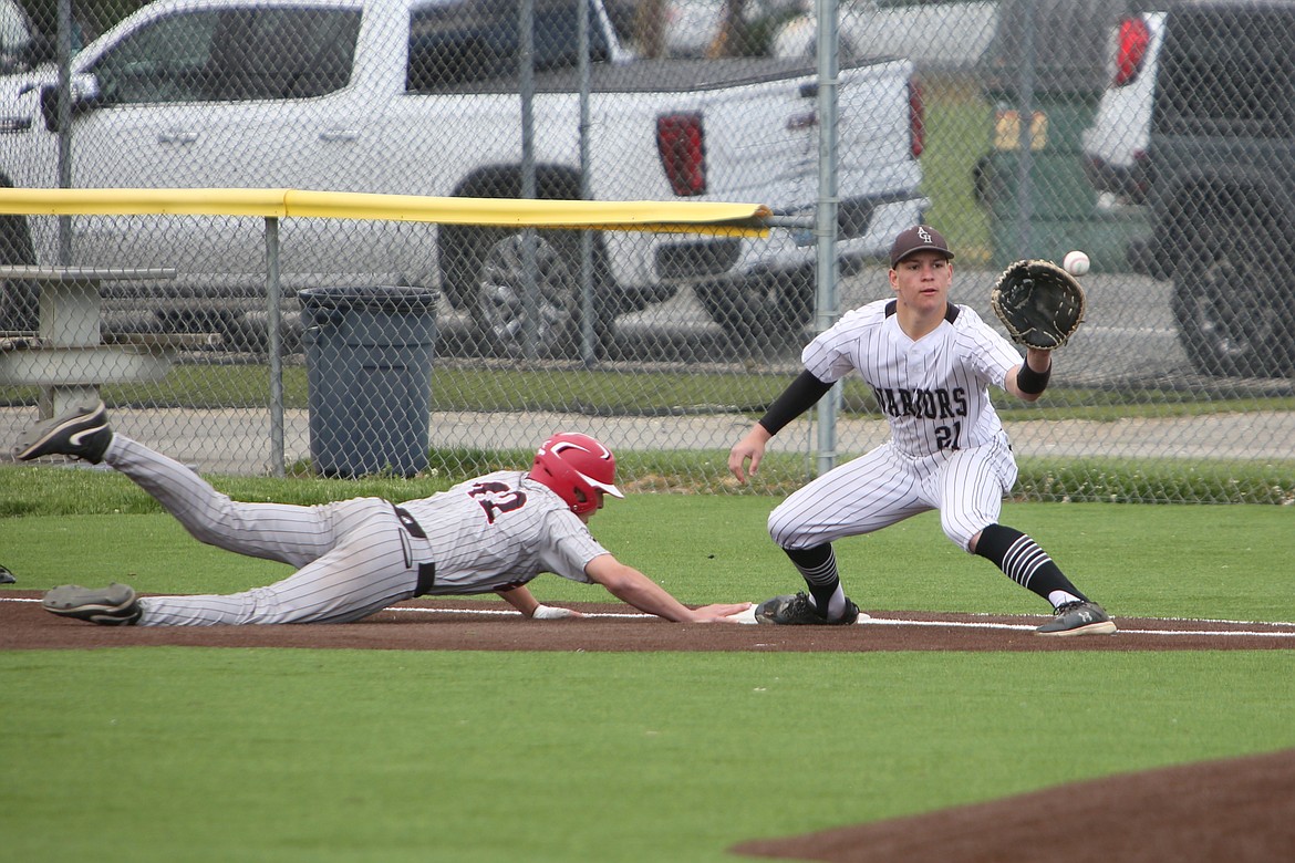 Almira/Coulee-Hartline senior John Pierce (21) catches a pick-off attempt at first base on Saturday against Northport.