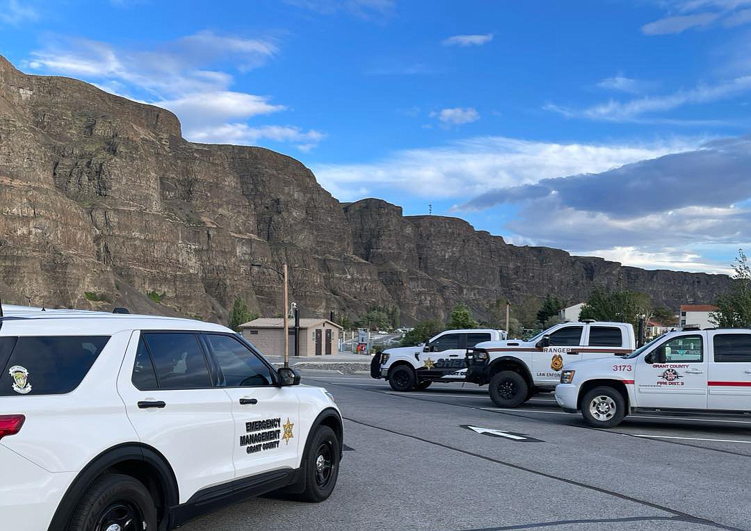 First responders climbed partway up this rock wall near Crescent Bar Saturday to recover the body of a man, whose identity has not yet been released, who drove over the cliff.