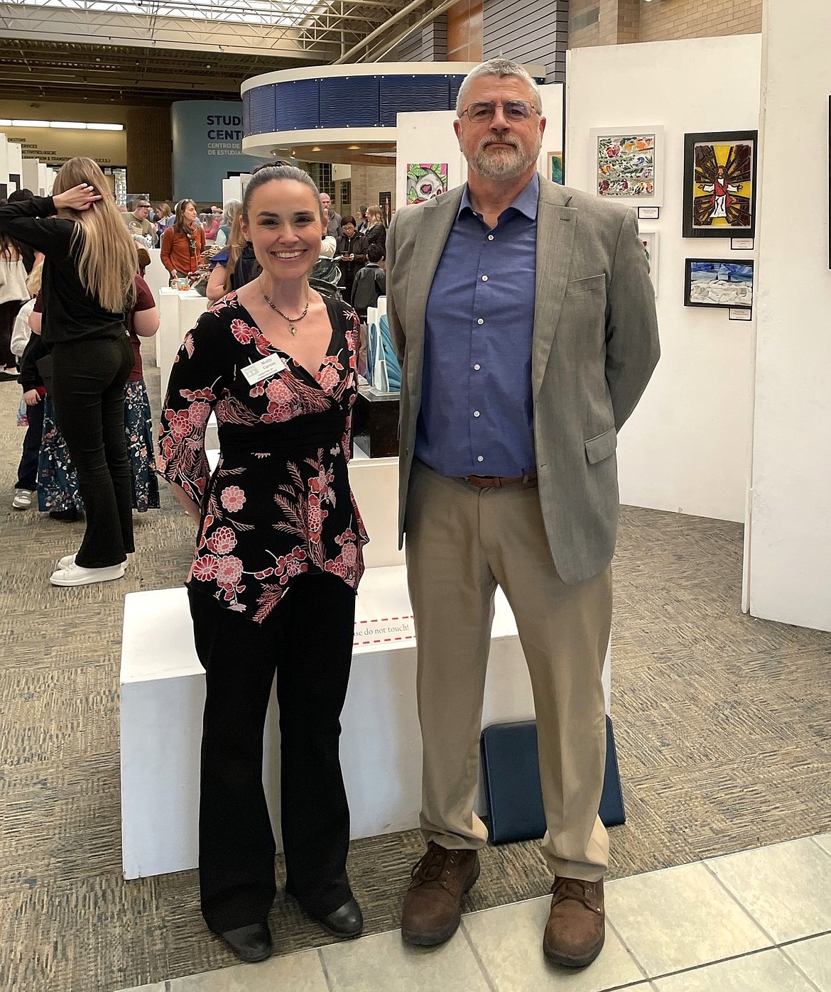 Educational Service District 123 Director of Communications Molly Curtiss, left, and Superintendent Steve McCullough, right, attend a regional art exhibit in the Tri-Cities in March.