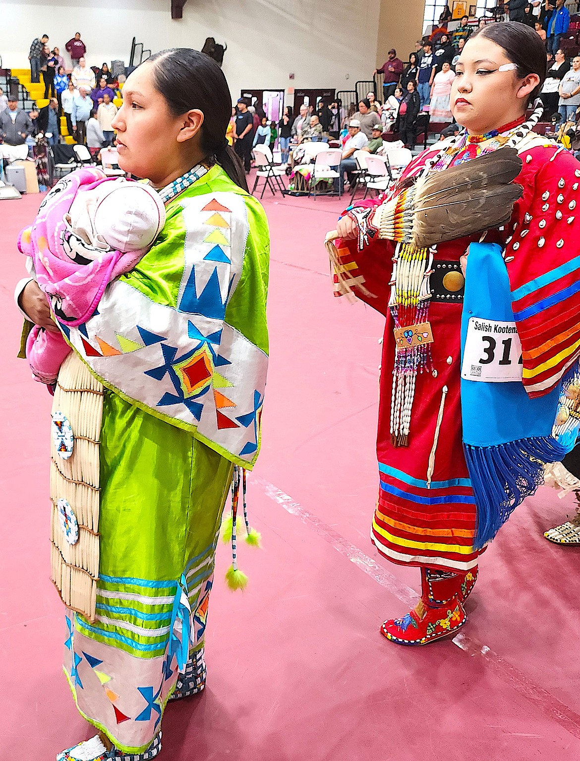 For many babies, this was their first powwow, and they were danced around the dance floor by a parent or a grandparent. (Berl Tiskus/Leader)