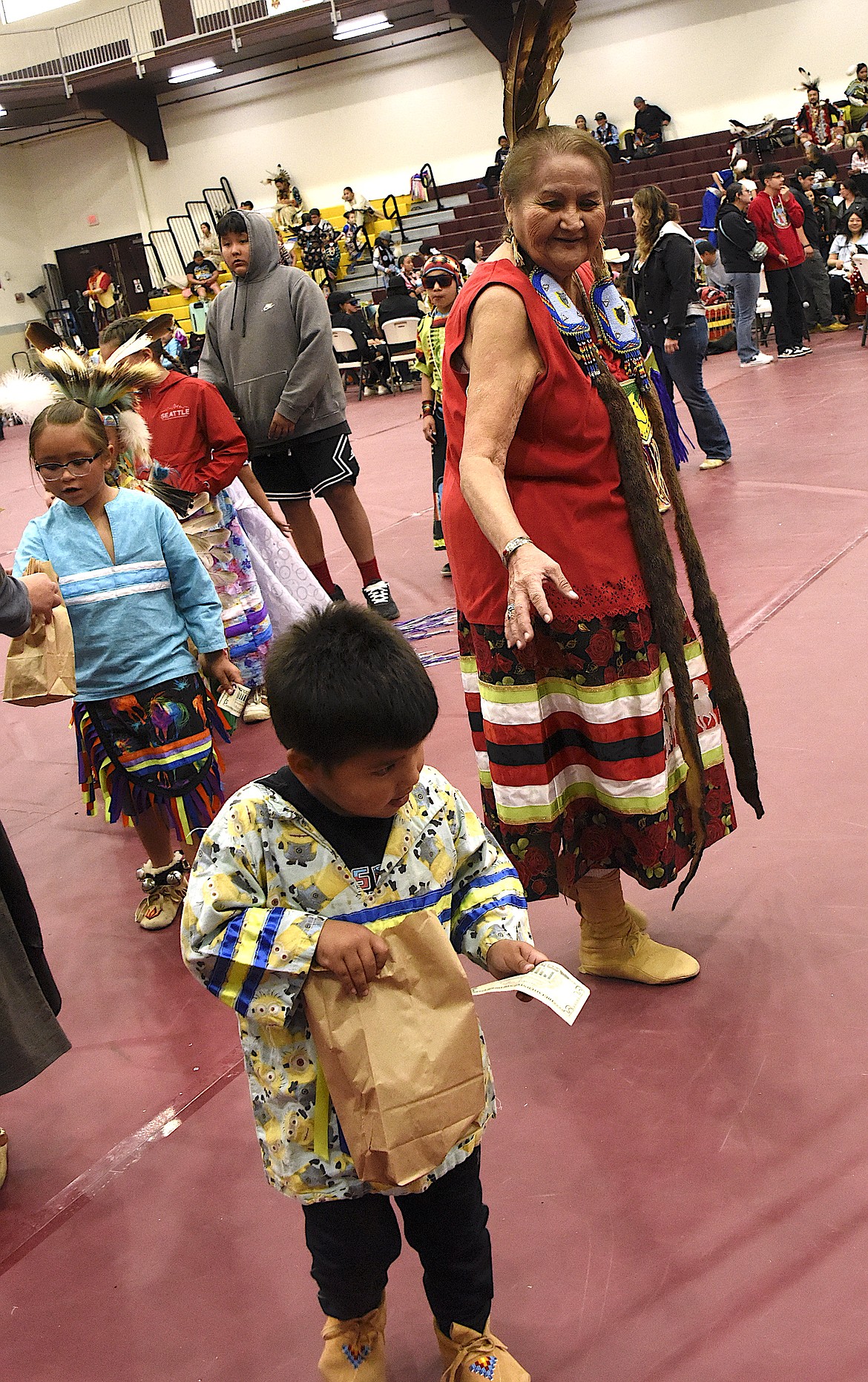 A Tiny Tot dancer receives a dollar and a bag of candy -- riches. (Berl Tiskus/Leader)
