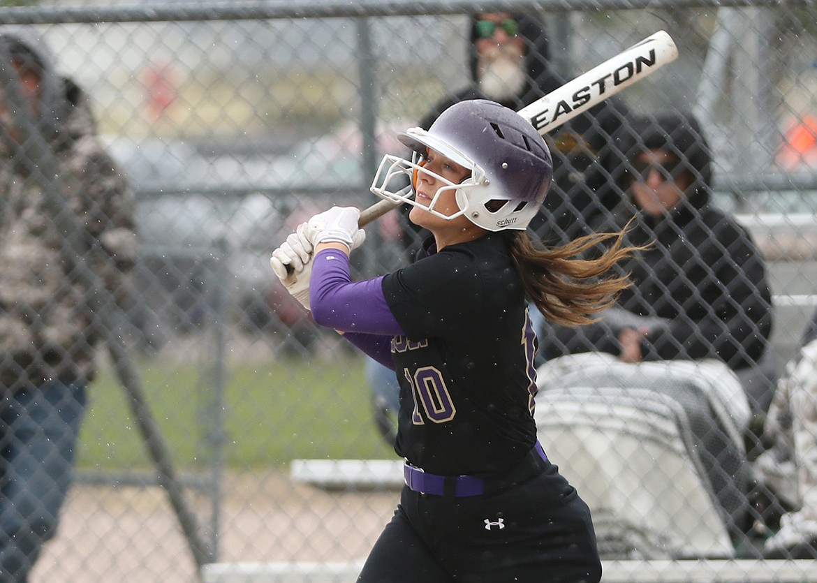 Lady Pirate Mckenna Hanson launches another homer during the Class A Divisional Tournament, held last week in Polson. (Bob Gunderson photo)