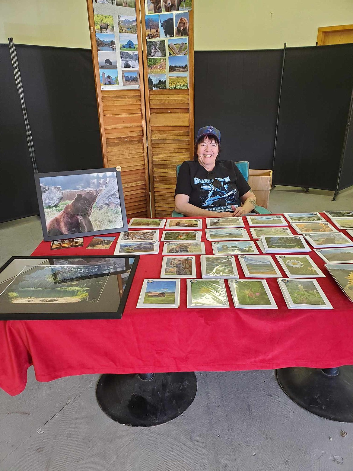 Rita Mae Anderson displays her local shots of wildlife, flowers and scenery through her business, Montana Love Photography at the Pop-Up Market in DeBorgia. (Photo courtesy Janet Hughes)