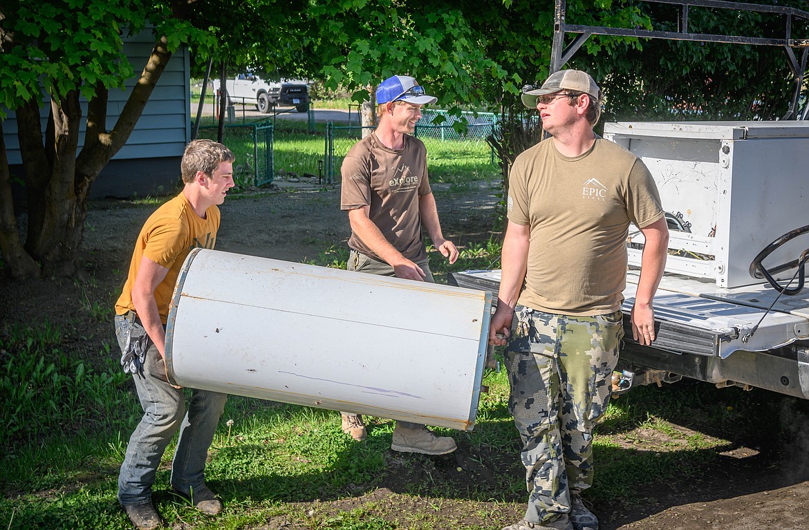 Old appliances were picked  Up by Garrett Boon, Bridger Bauer and Remington Ryan. (Tracy Scott/Valley Press)