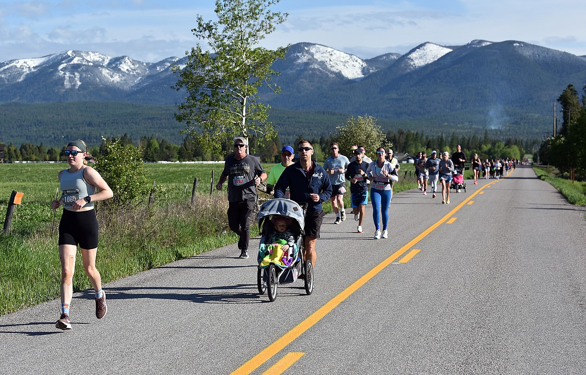 Runners head down Dillon Road at the Whitefish Marathon. (Julie Engler/Whitefish Pilot)