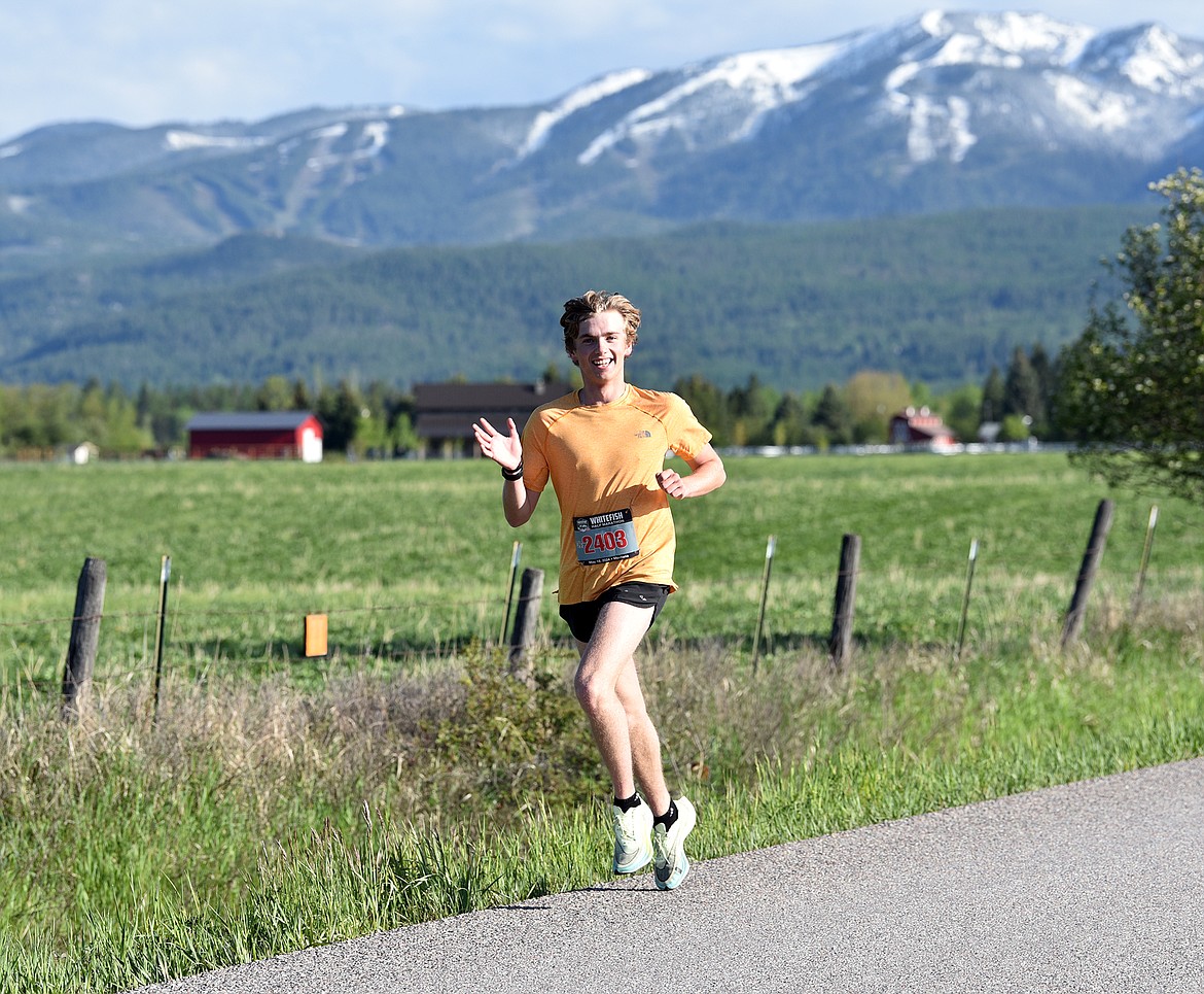 A runner enjoys the Whitefish Marathon May 18, 2024. (Julie Engler/Whitefish Pilot)