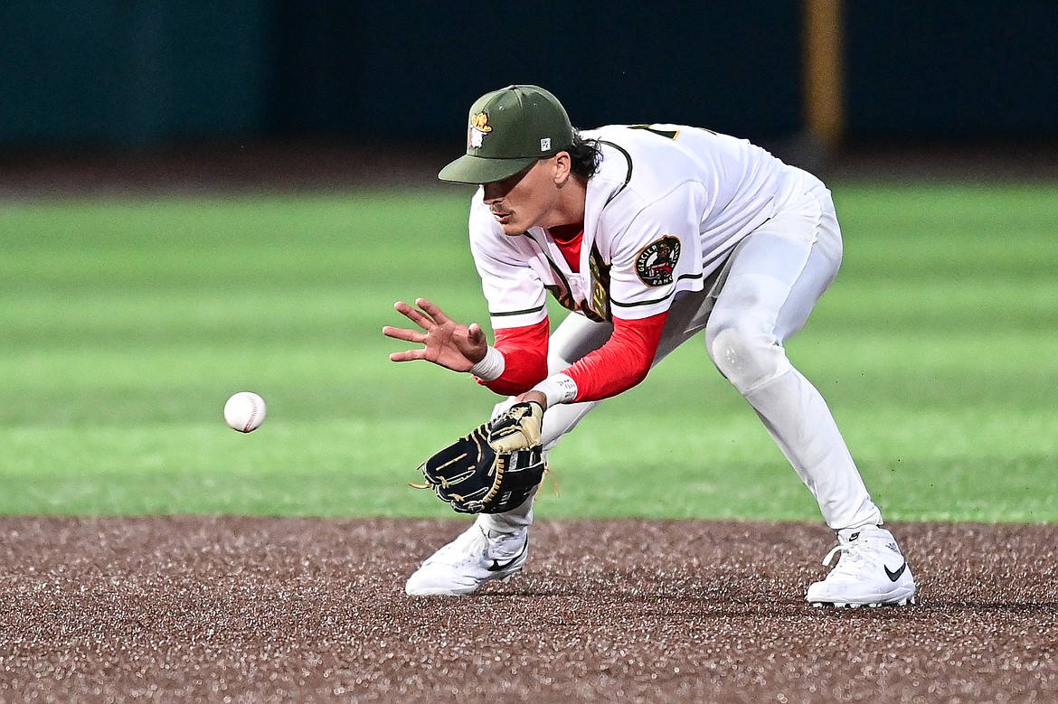Glacier shortstop Mason Dinesen (23) fields a ground ball against the Oakland Ballers at Glacier Bank Park on Tuesday, May 21. (Casey Kreider/Daily Inter Lake)
