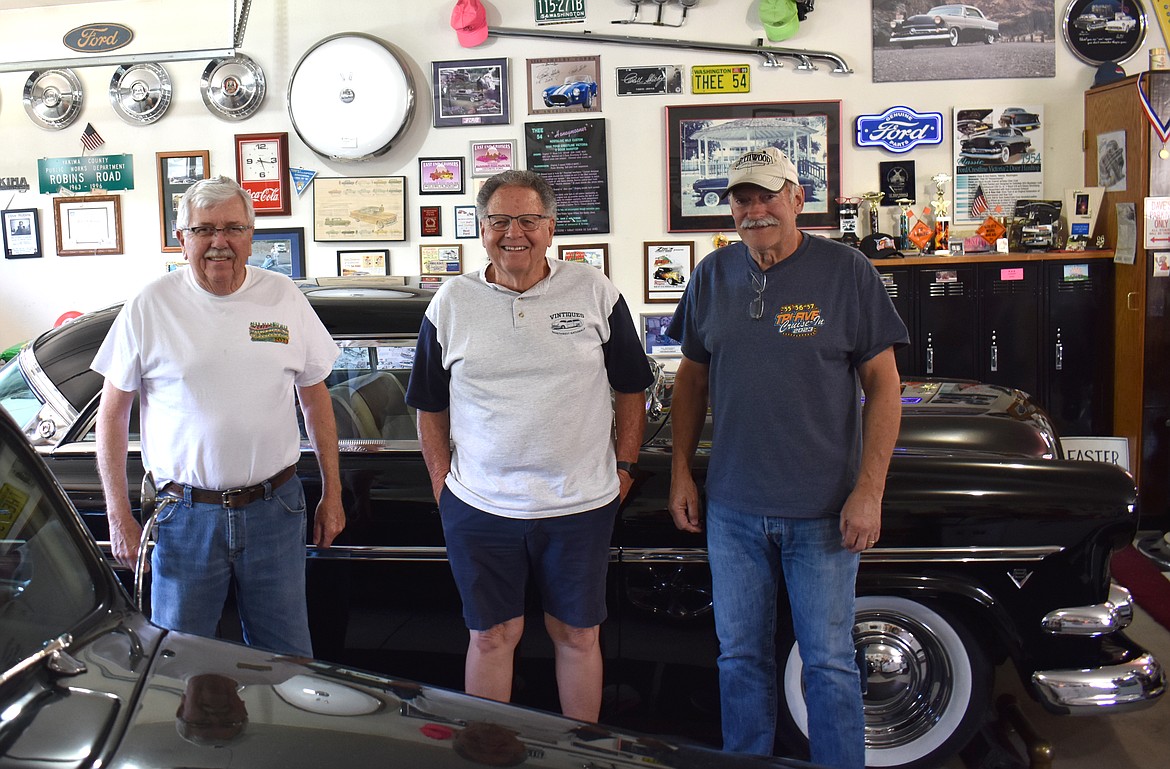 From left: Moses Lake Classic Car Club members Larrie Chmela, Doug Robins and Dennis Jackson stand in front of Robins’ 1953 Crestline. The club is organizing a cruise through Moses Lake on Friday.